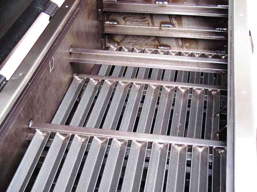 view of three different levels for charcoal racks in model 2454XL charcoal grill