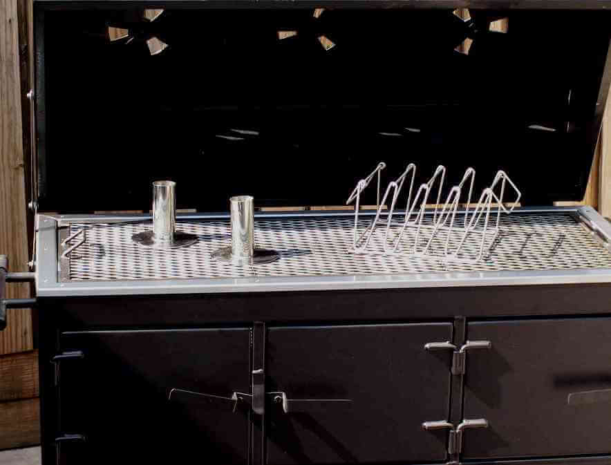 optional drunken chicken stands and stainless steel rib rack sitting on grill grate of model 2454XL charcoal grill