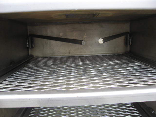 swivel meat arms inside vertical chamber of model 1628CC smoker pit