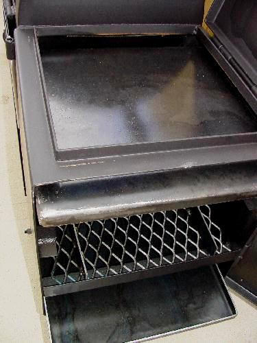wood rack top in top position in model 2040 smoker pit firebox